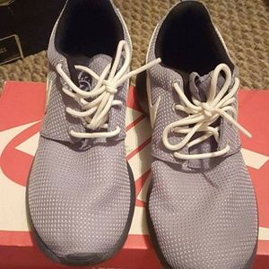 Size 4.5 youth. Low Gray Nike shoes