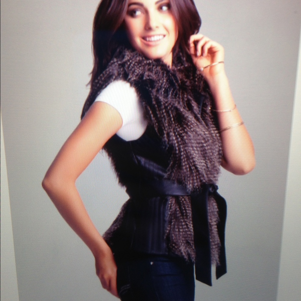 BEBE faux fur belted vest.