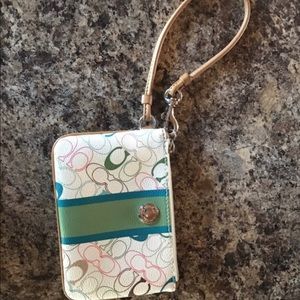 Green and brown leather coach wristlet