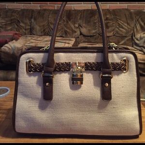 Tan satchel with brown trim, medium