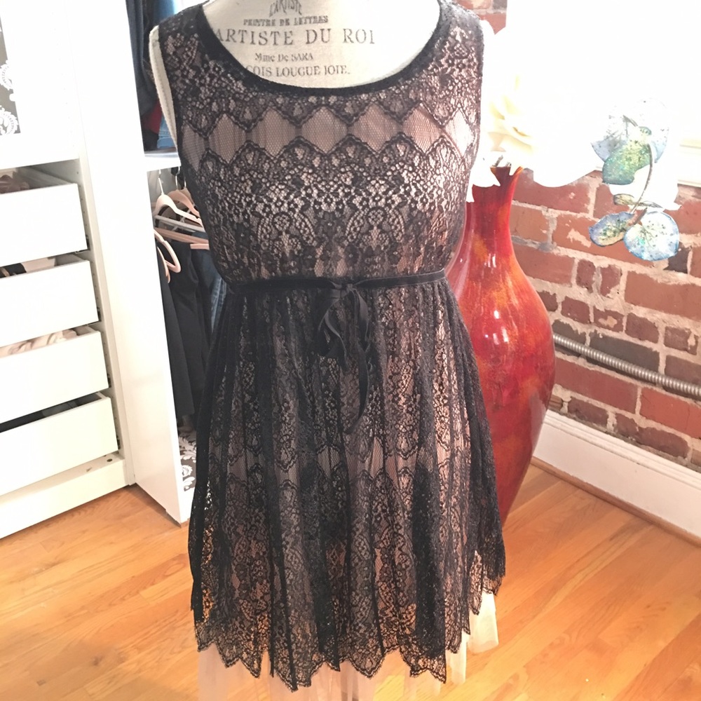 Feminine Black net lace dress with nude sheath
