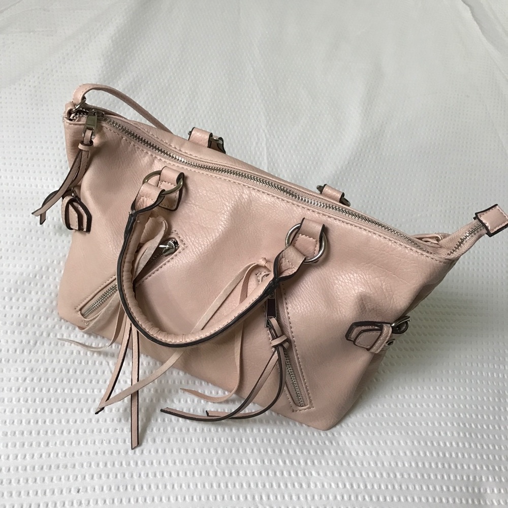 Pink shoulder bag with ties and zippers