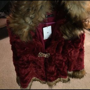 Red and tan faux fur coat with hood.