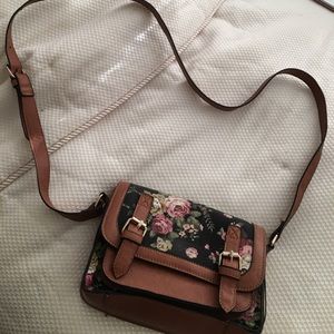 A vintage floral cross body bag