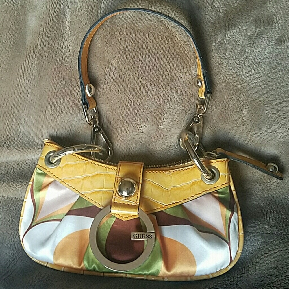 Guess brand multi colored clutch