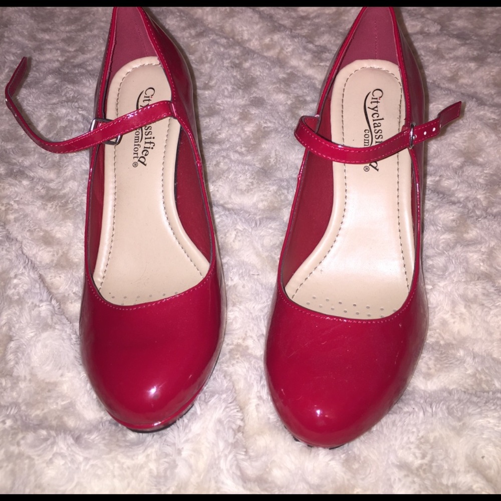 Shiny red ankle strap heels