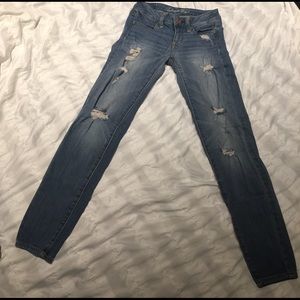 American Eagle light wash destressed skinny jeans