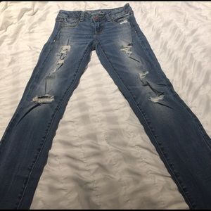 American Eagle light wash destroyed skinny jeans