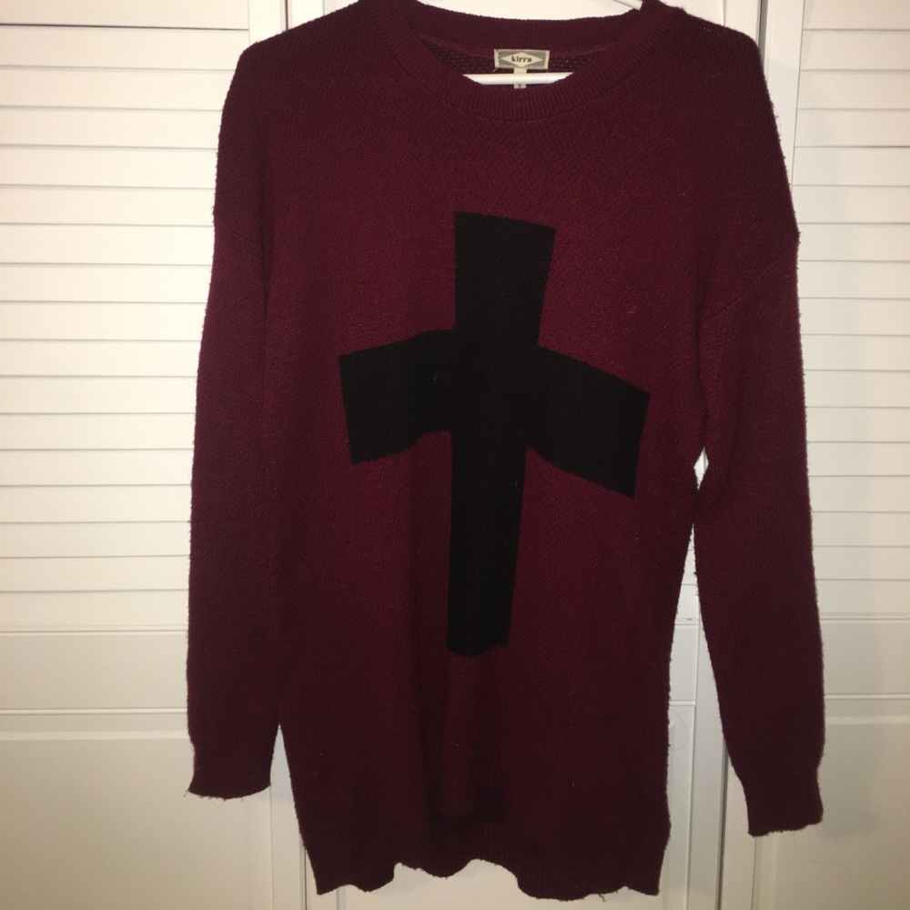 Cross sweater.