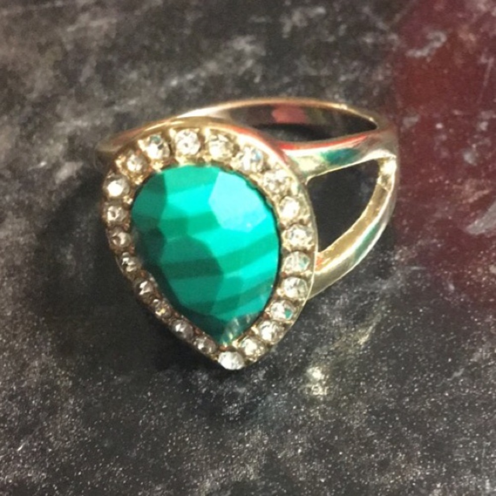 Rhinestone studded green ring.