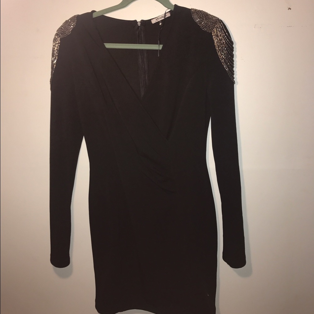 Black mini dress with sequenced shoulder padding