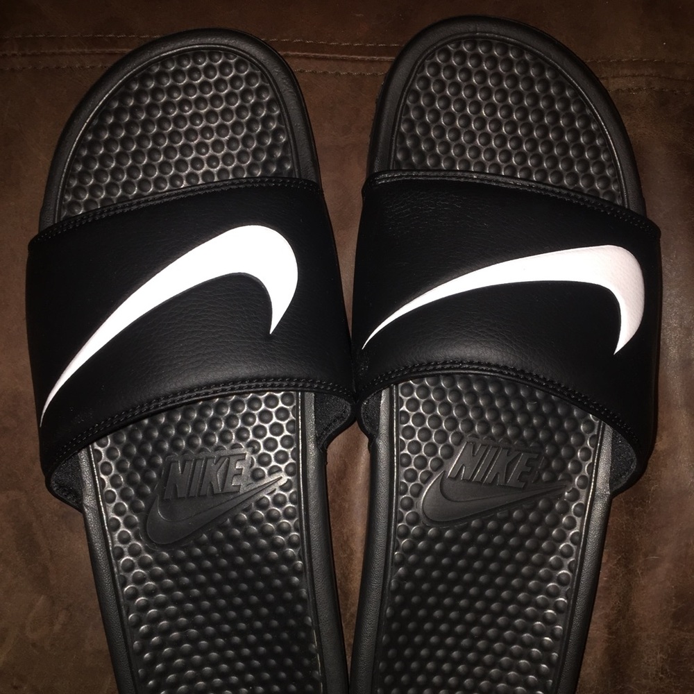 Black and white Nike slides