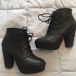 Heeled black booties