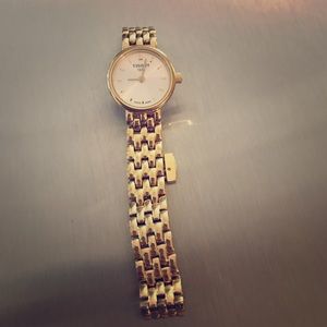 Tissot gold watch. With extra links