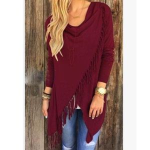 Wrap sweater with fringe.
