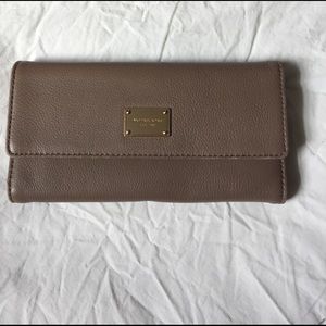 Michael Kors soft checkbook wallet.