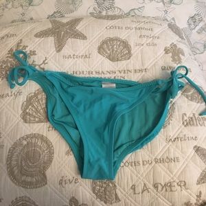 Teal swimsuit bottoms with braided detail