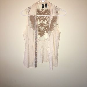 Cream buckle vest with light brown stitching!