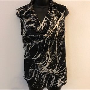 sleeveless,ruffle front, super chic....