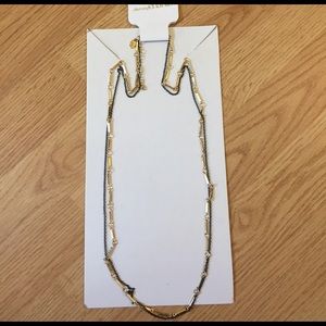 Long super cute black and gold necklace!
