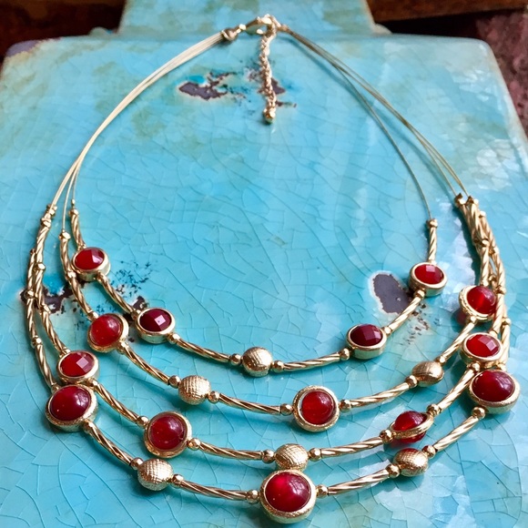 Four strand wire necklace with red stones