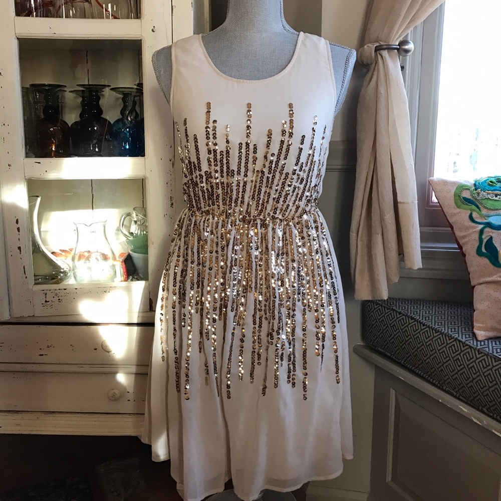 Off-white Dress with Gold Emblems