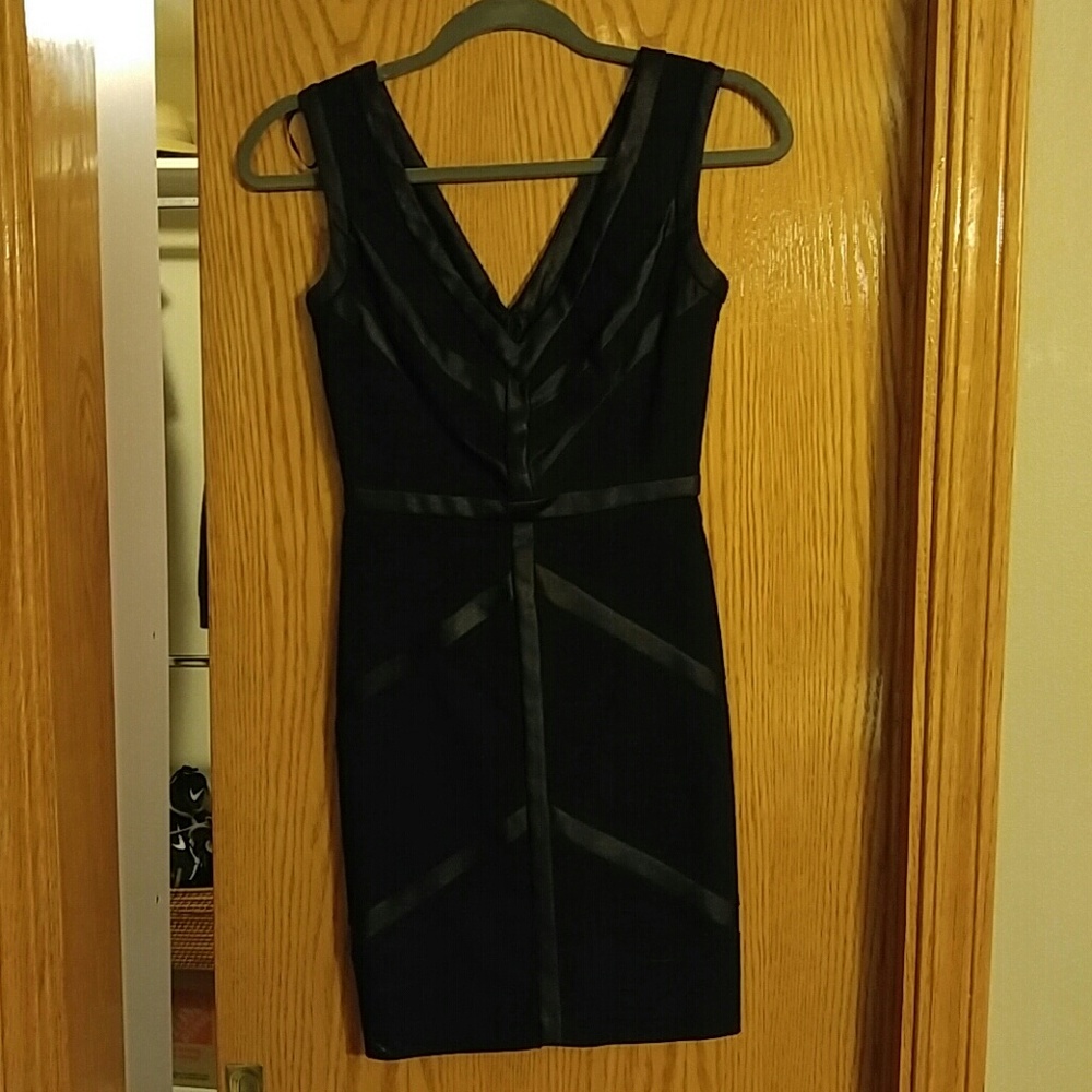 Body con Deep v black mini dress with satin detal