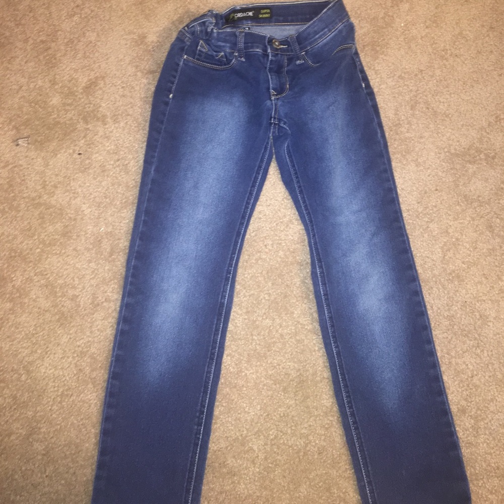 A pair of girls super skinny jeans