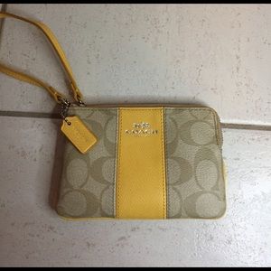 Coach corner zip wristlet in yellow