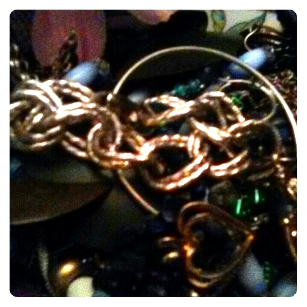 A variety jar of junk drawer jewelry