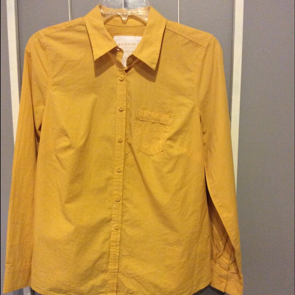 Mustard gold shirt.