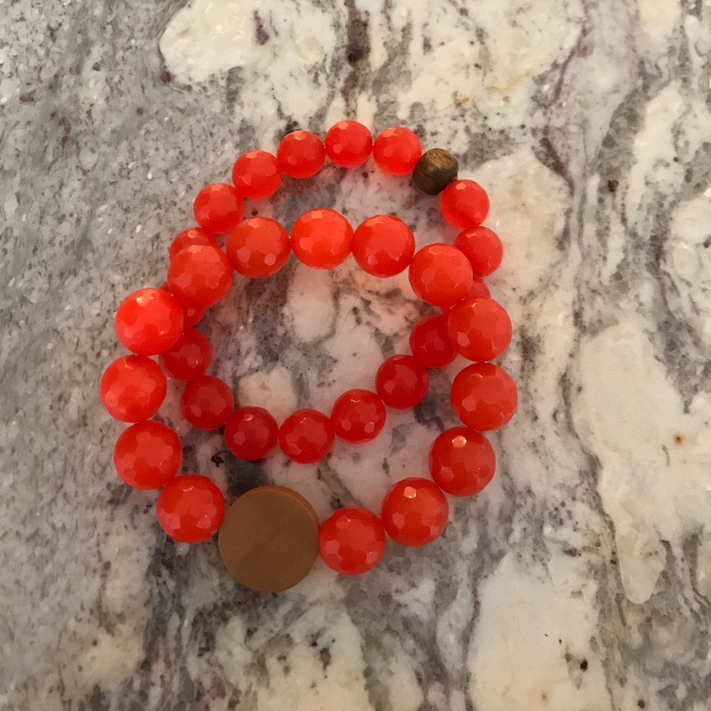 Orange beaded bracelets with wood