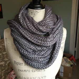 Silver-grey metallic knit scarf.