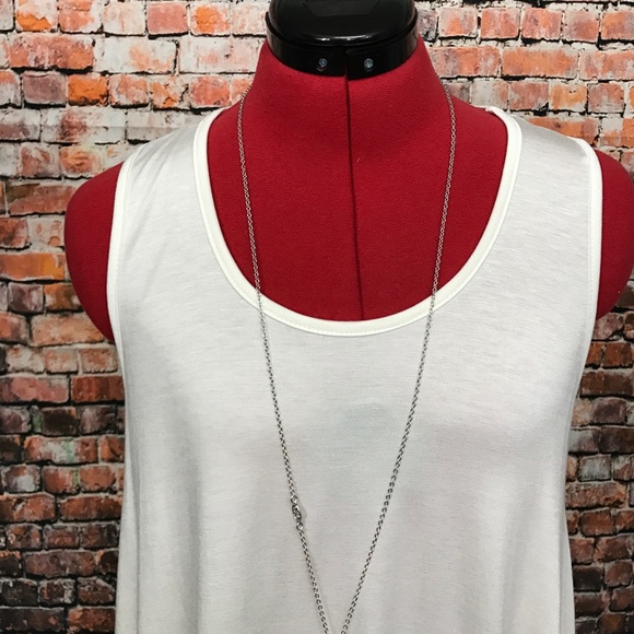 HP! Sleeveless Ivory Ruffle Hem Knit Tunic - Picture 5 of 10