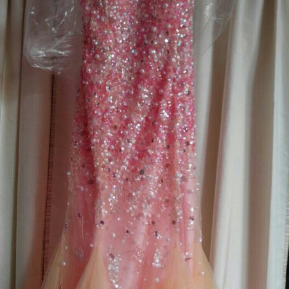 Coral beaded prom gown