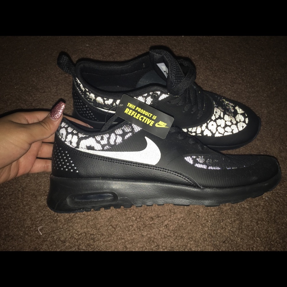 Nike shoes . Size 8.5. This product is reflective.
