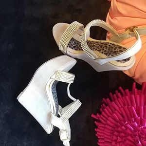 Rhinestone trimmed, faux suede wedge