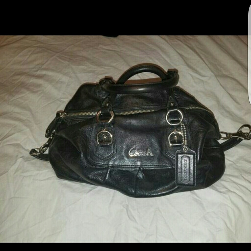 Black leather Coach duffle style handbag