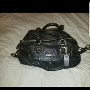 Black leather Coach duffle style handbag