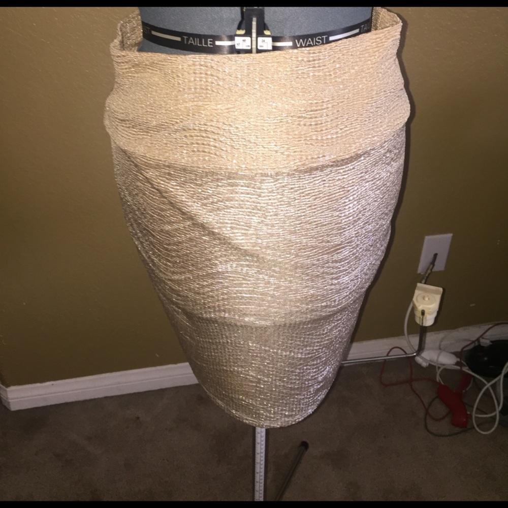 19" length Ivory shiny skirt. %100 polyester