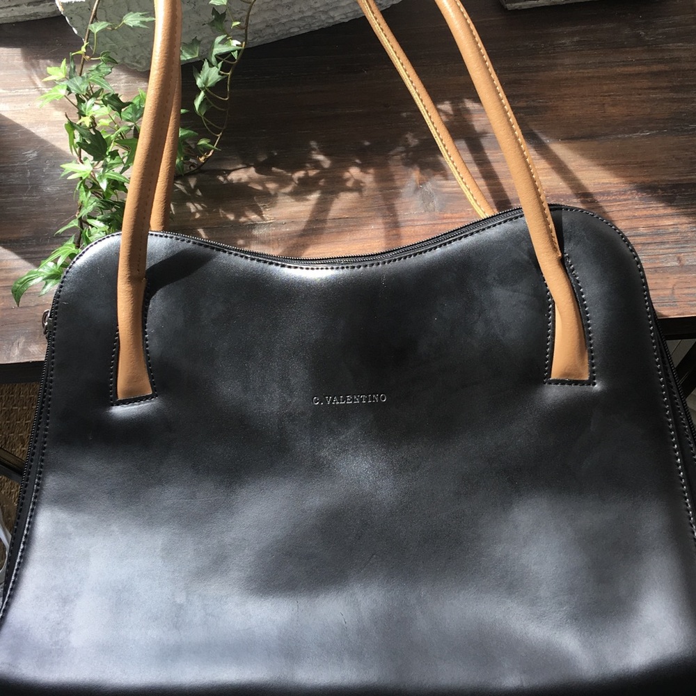 C. VALENTINO Black purse.