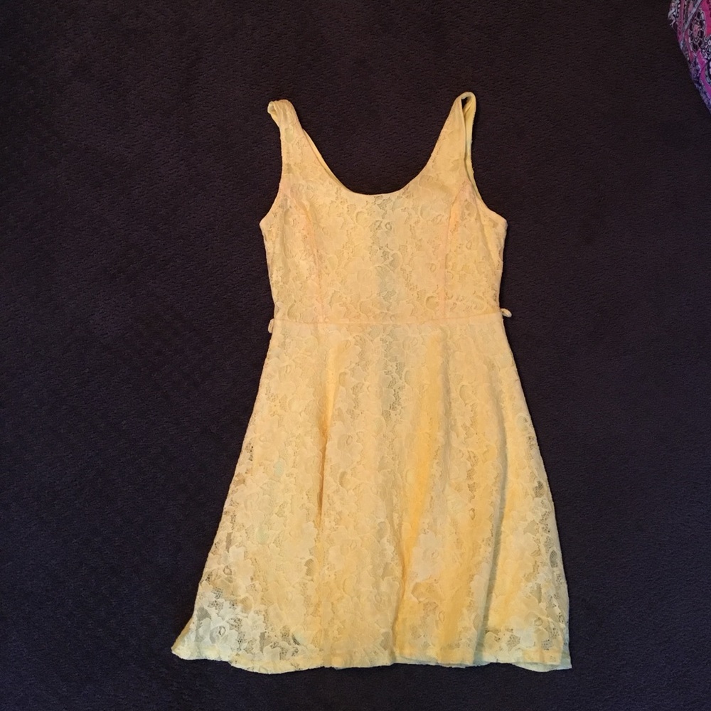 Bright yellow laced skater dress