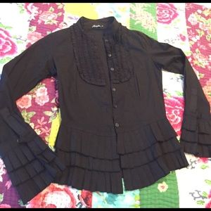 Black long sleeve button up. It runs small.