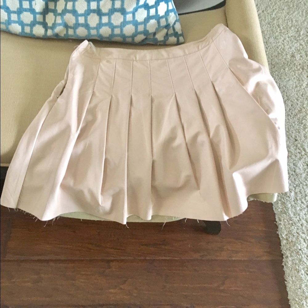 cream colored skirt.