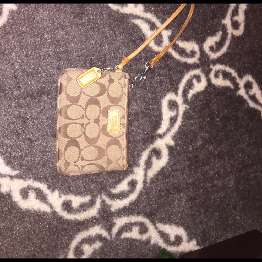 Classic tan Coach wristlet