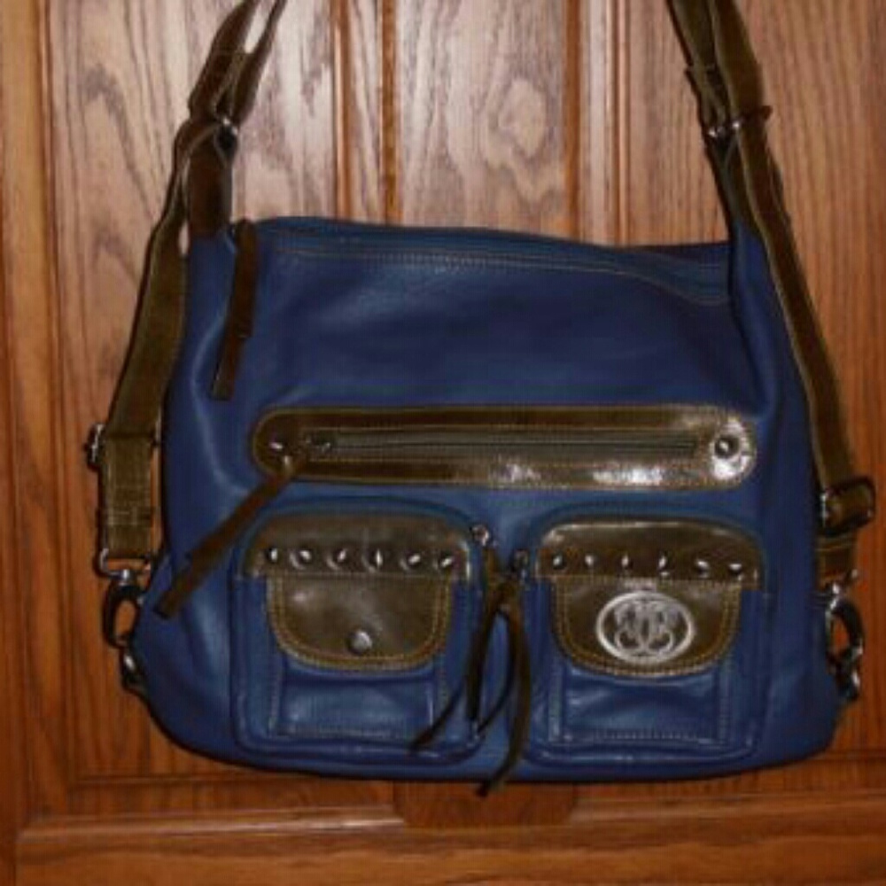 Sharif navy leather crossbody bag with brown trim.