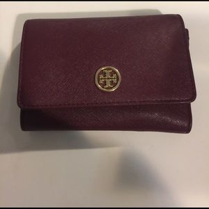 Tory Burch cranberry cranberry colored wallet.