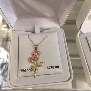 Rose gold and gold rose pendant