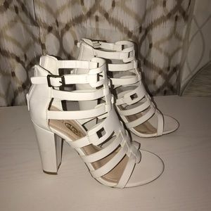 Strapped white heels