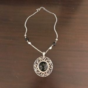 Black and silver colored necklace